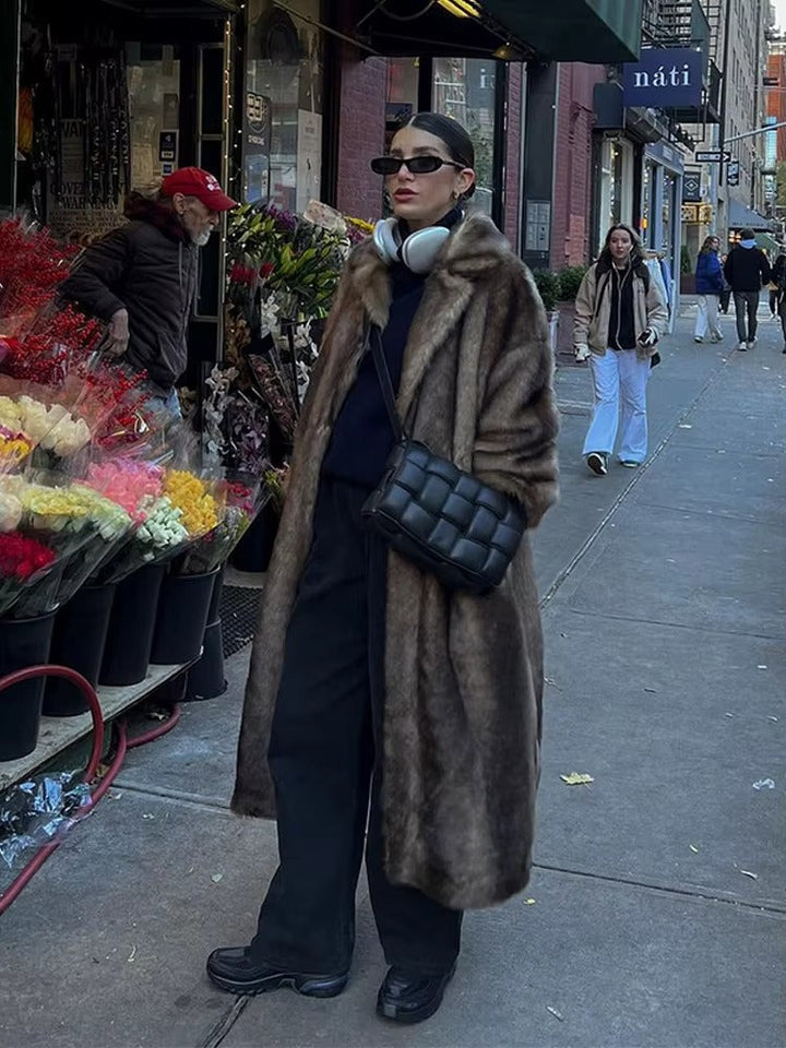 Elegant dark brown women's long winter coat, a sophisticated and warm oversized outerwear piece.