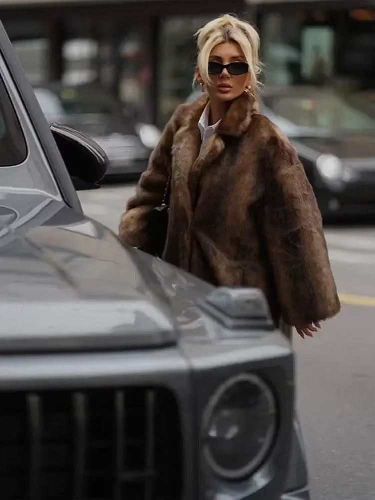 Fashionable women's elegant long dark brown winter coat, oversized outerwear for a sophisticated style.