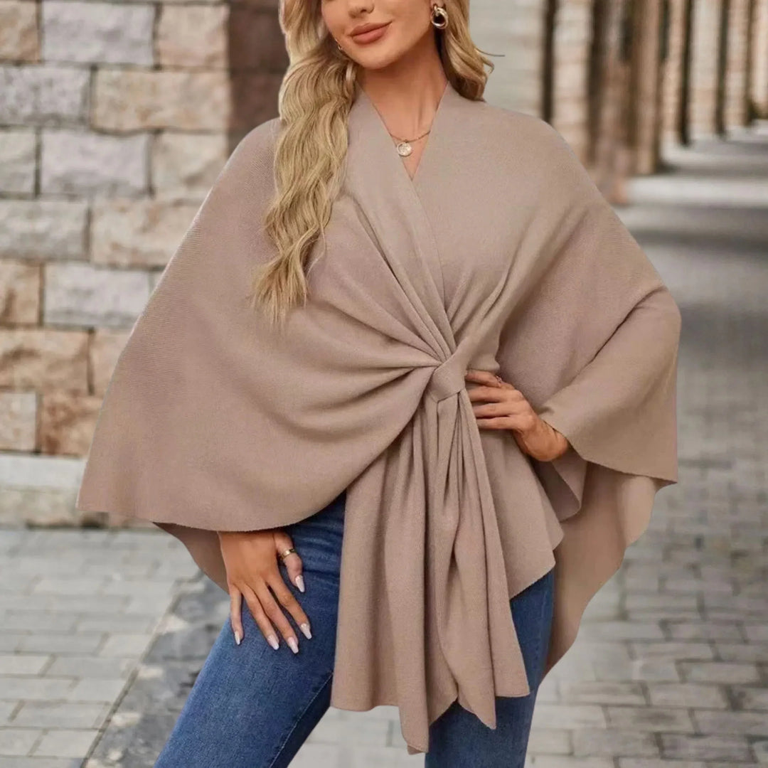 Stylish women's pullover poncho, elegant draped design, cozy comfortable fall winter layer.
