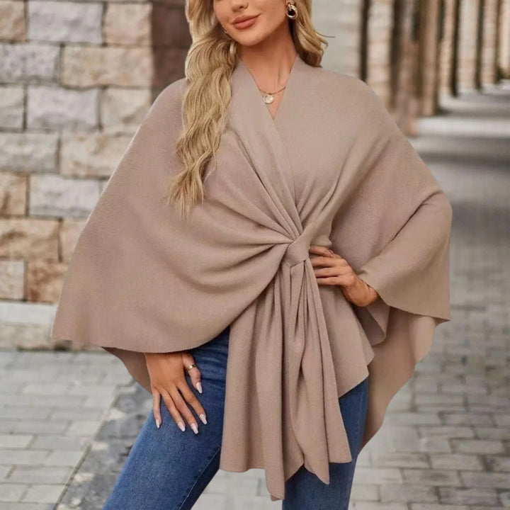 Stylish women's pullover poncho, elegant draped design, cozy comfortable fall winter layer.