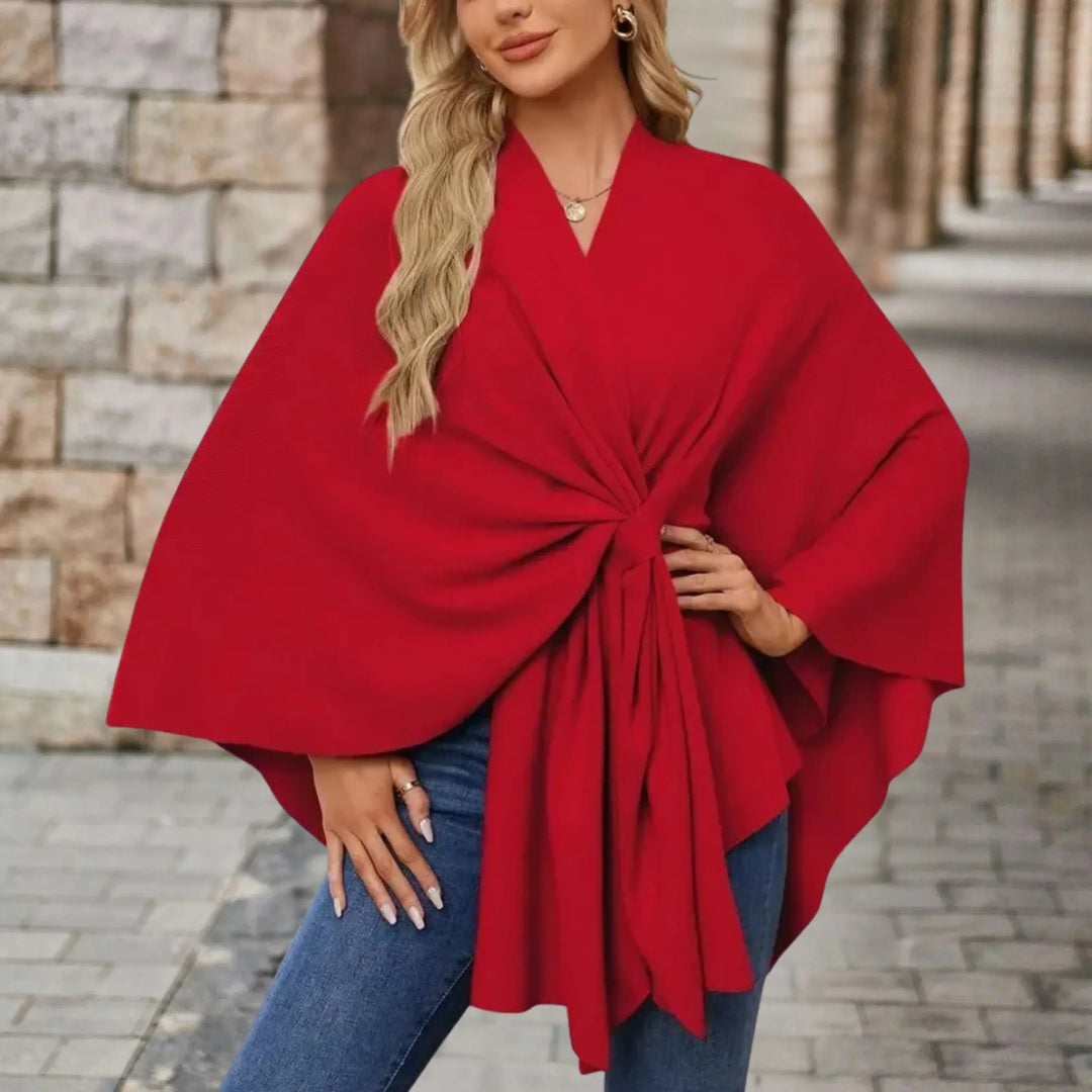 Elegant women's poncho, beautifully draped and cozy, a versatile layer for winter style.