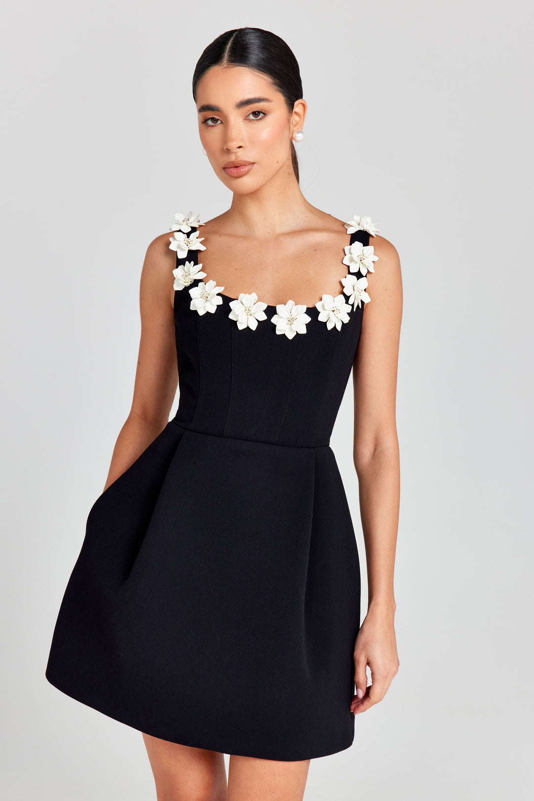 Chic women's summer mini dress featuring delicate floral appliqué and a flattering A-line cut.