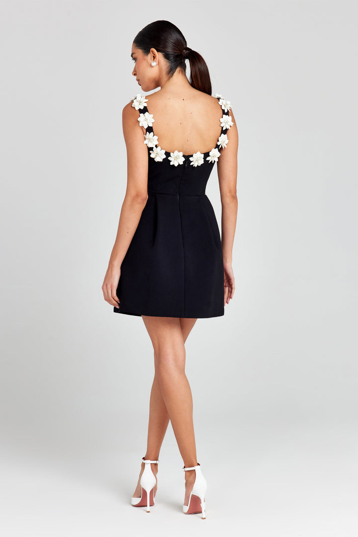 Beautiful women's floral appliqué summer mini dress. Chic A-line style with practical pockets.
