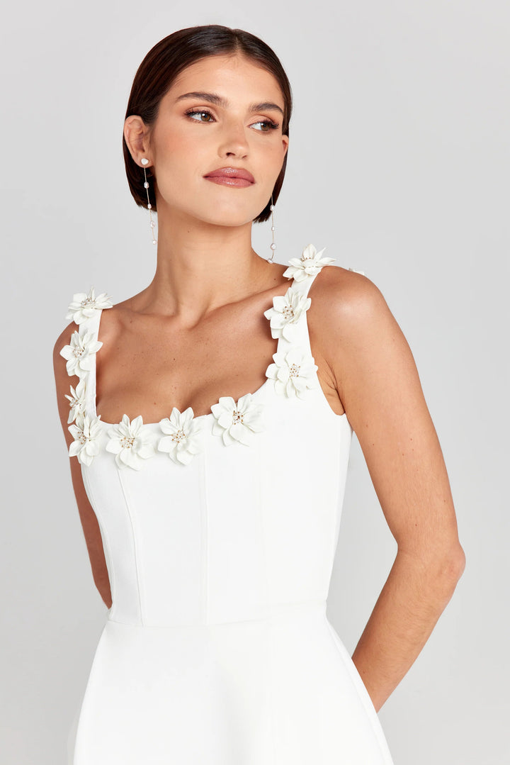 Delicate floral appliqué on this women's summer mini dress. Feminine A-line cut, perfect for parties.