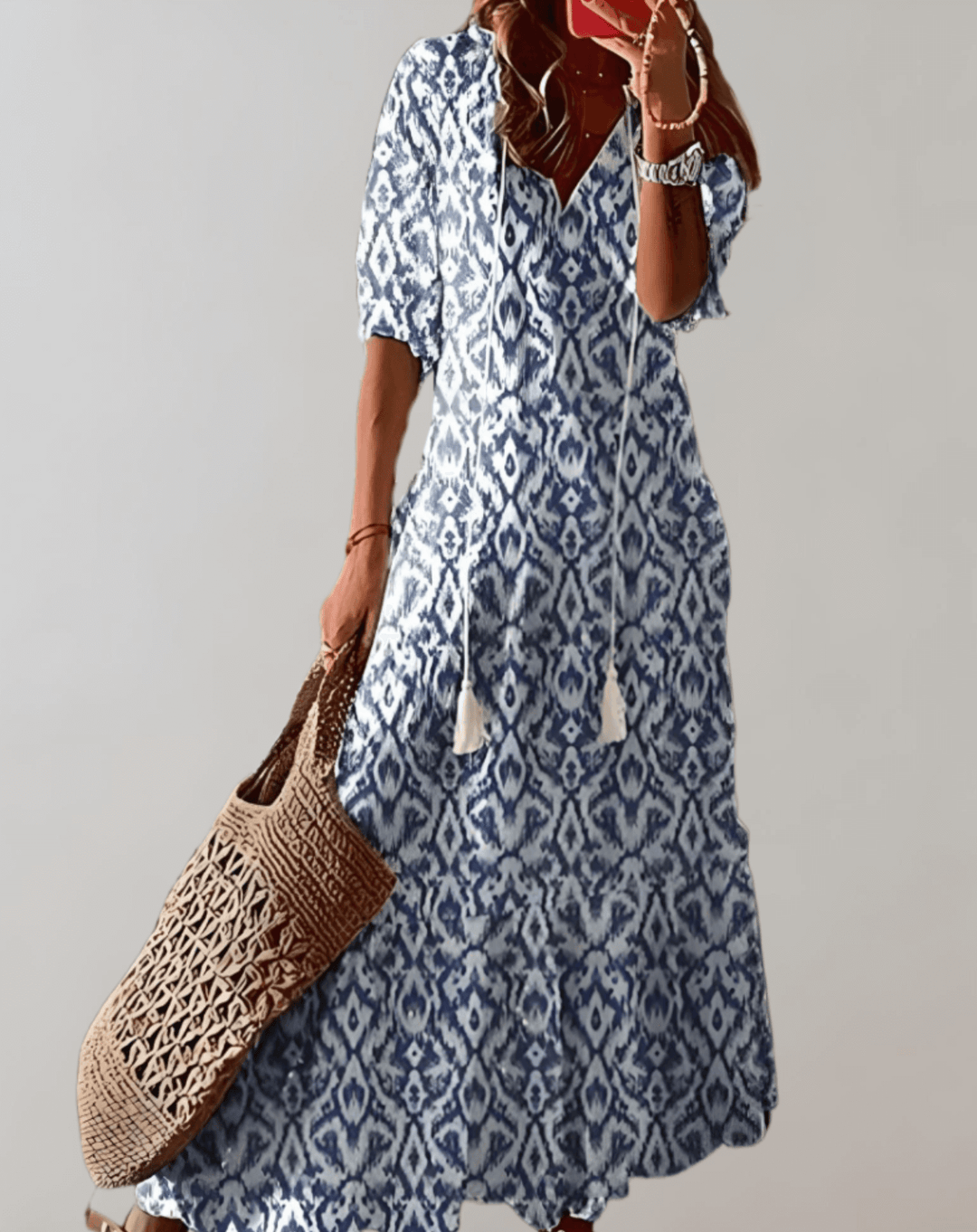 Elegant women's maxi dress with vibrant floral pattern, great for summer fashion.