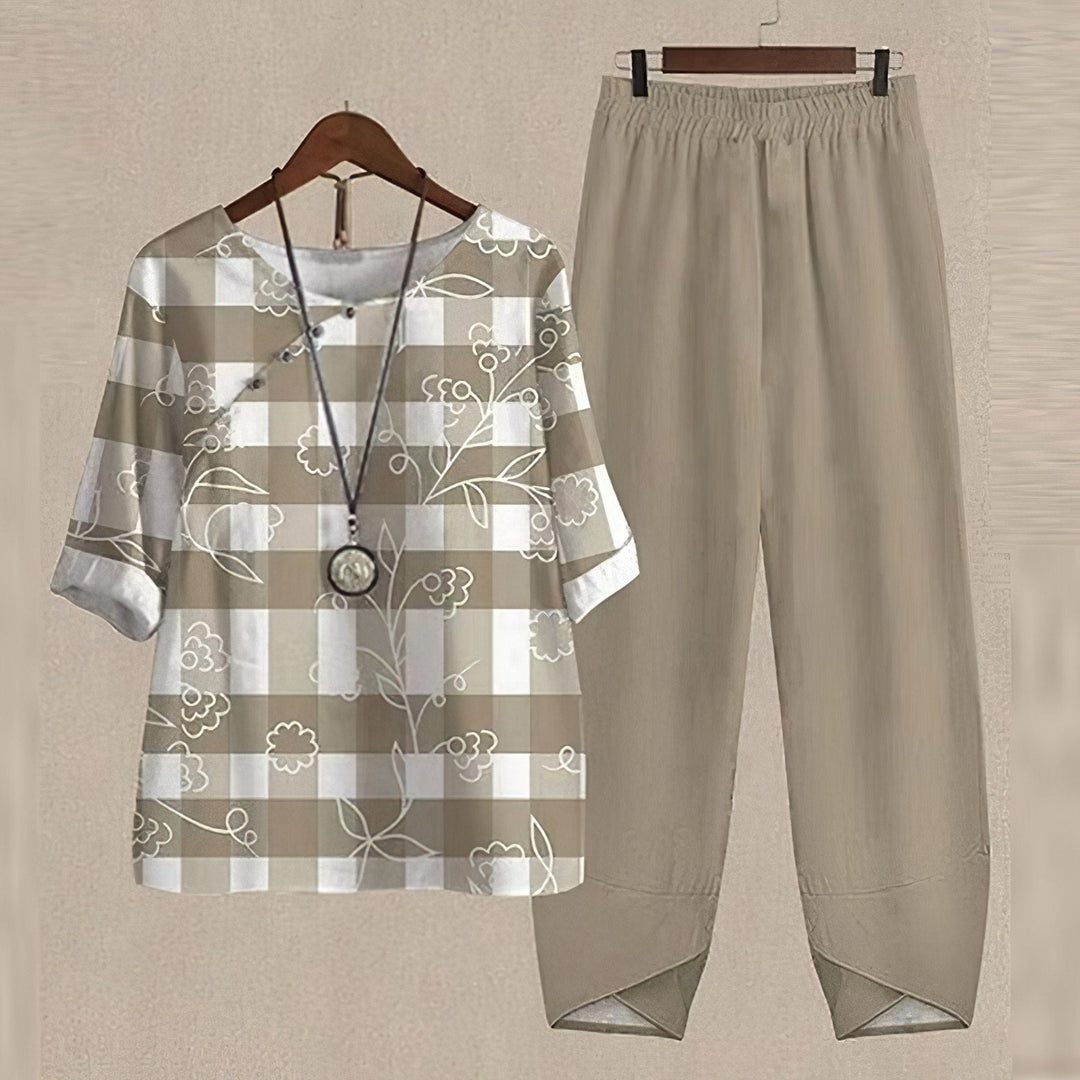 Beautiful women's floral two-piece set, perfect for elegant casual wear. Includes a relaxed blouse & elastic waist pants.
