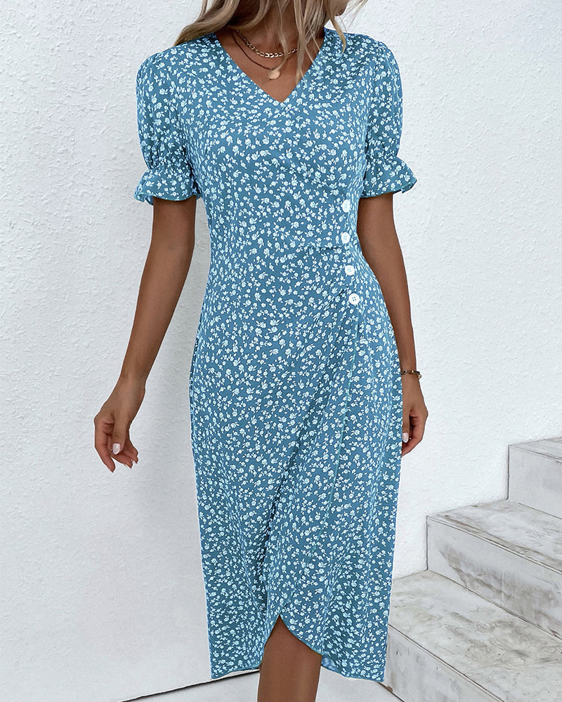 Side profile of a woman wearing a flattering floral v-neck dress, highlighting its elegant midi silhouette.
