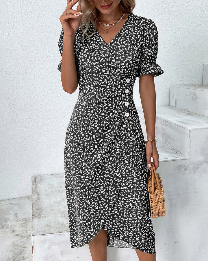 Woman wearing feminine floral v-neck midi dress, showcasing its elegant, versatile style for spring/summer.