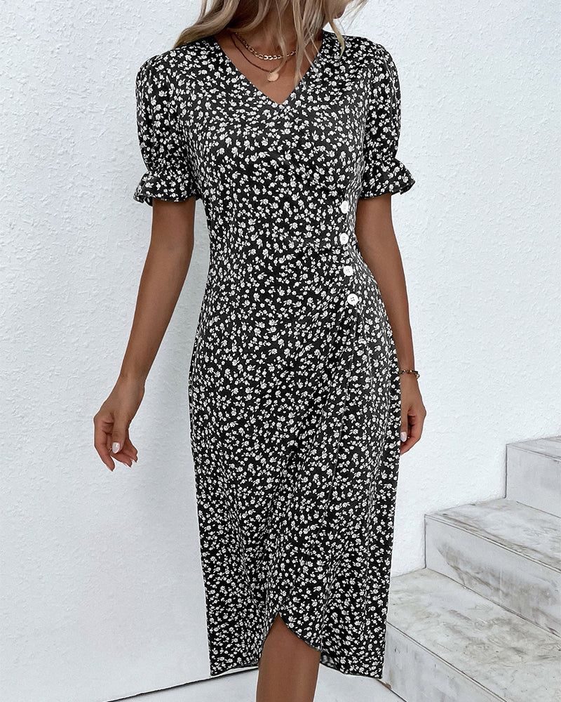 Elegant woman in chic floral v-neck midi dress, ideal for sophisticated spring and summer occasions.