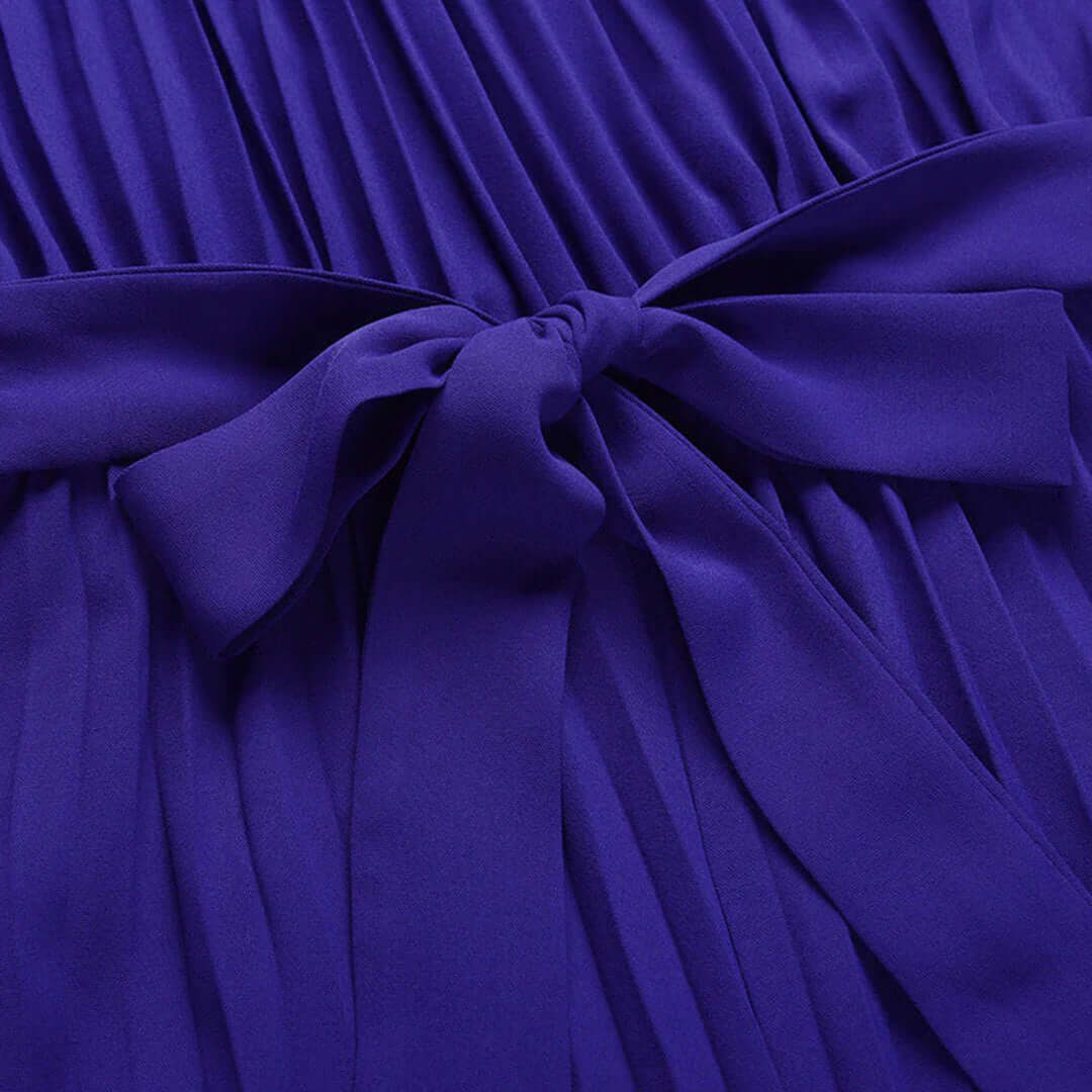 Flowy halter neck pleated wide leg jumpsuit for women. Perfect elegant summer & spring fashion.