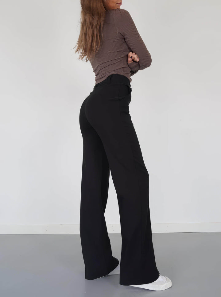 Comfortable women's elegant trousers with a high waist and straight leg, ideal for a polished look.