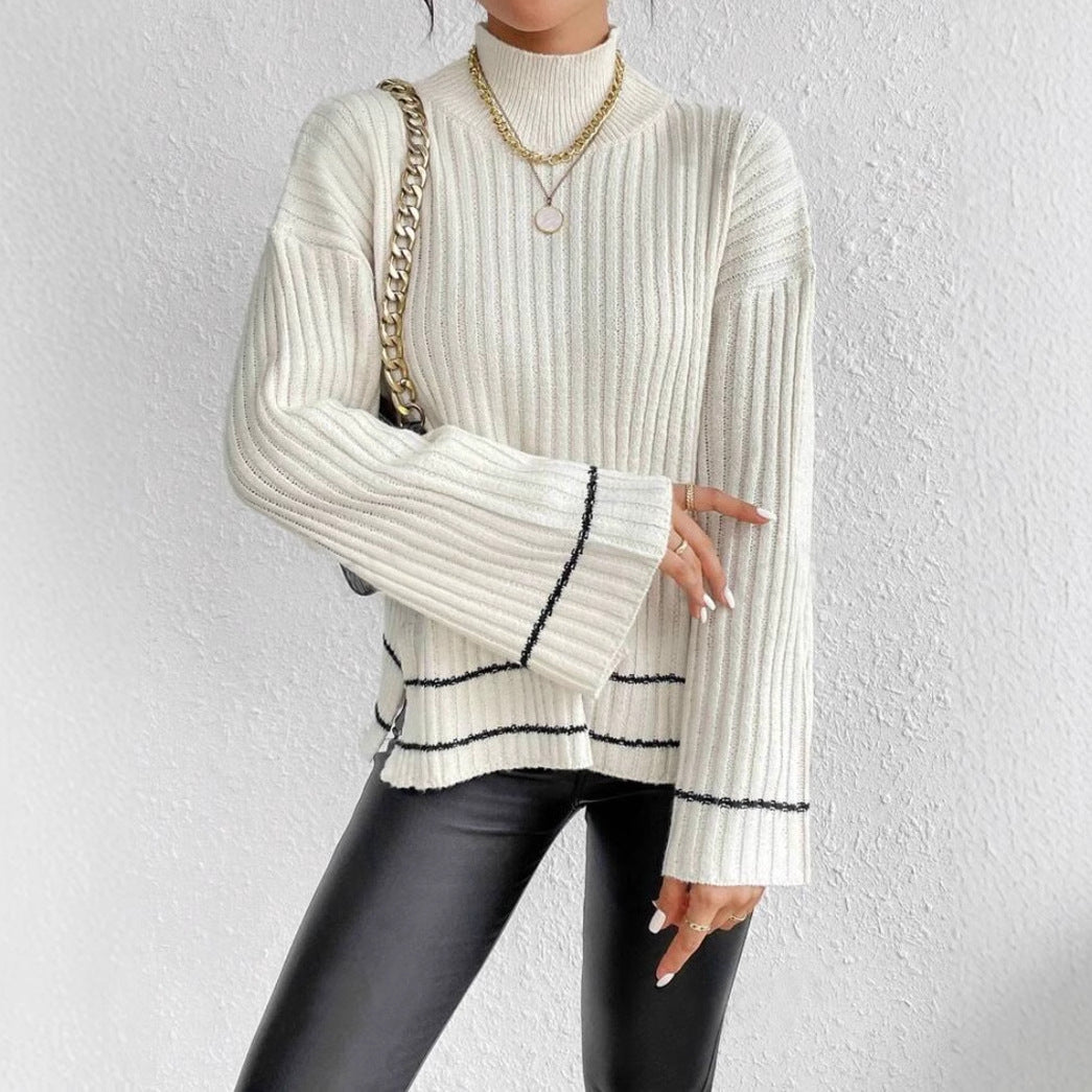 Stylish women's pullover with striking contrast stripes & trendy flared sleeves. Perfect for casual chic winter fashion.