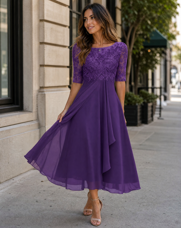 Flowy women's cocktail midi dress featuring an elegant lace top, perfect for parties.