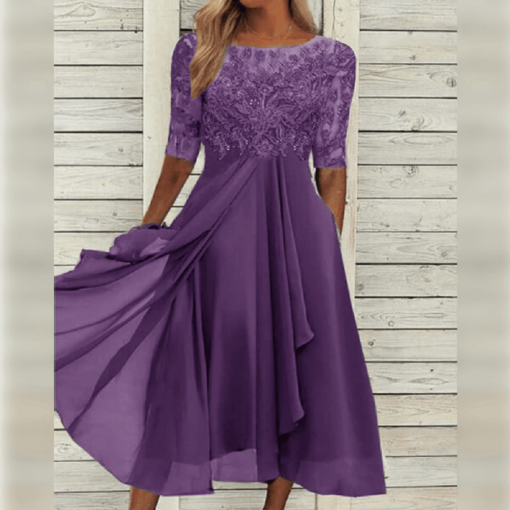 Formal women's midi length dress with delicate lace bodice, suitable for elegant occasions.