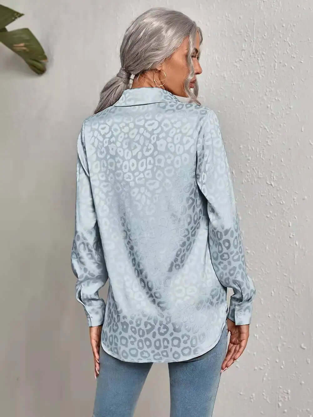 Women's sophisticated animal print jacquard blouse, elegant long sleeve.