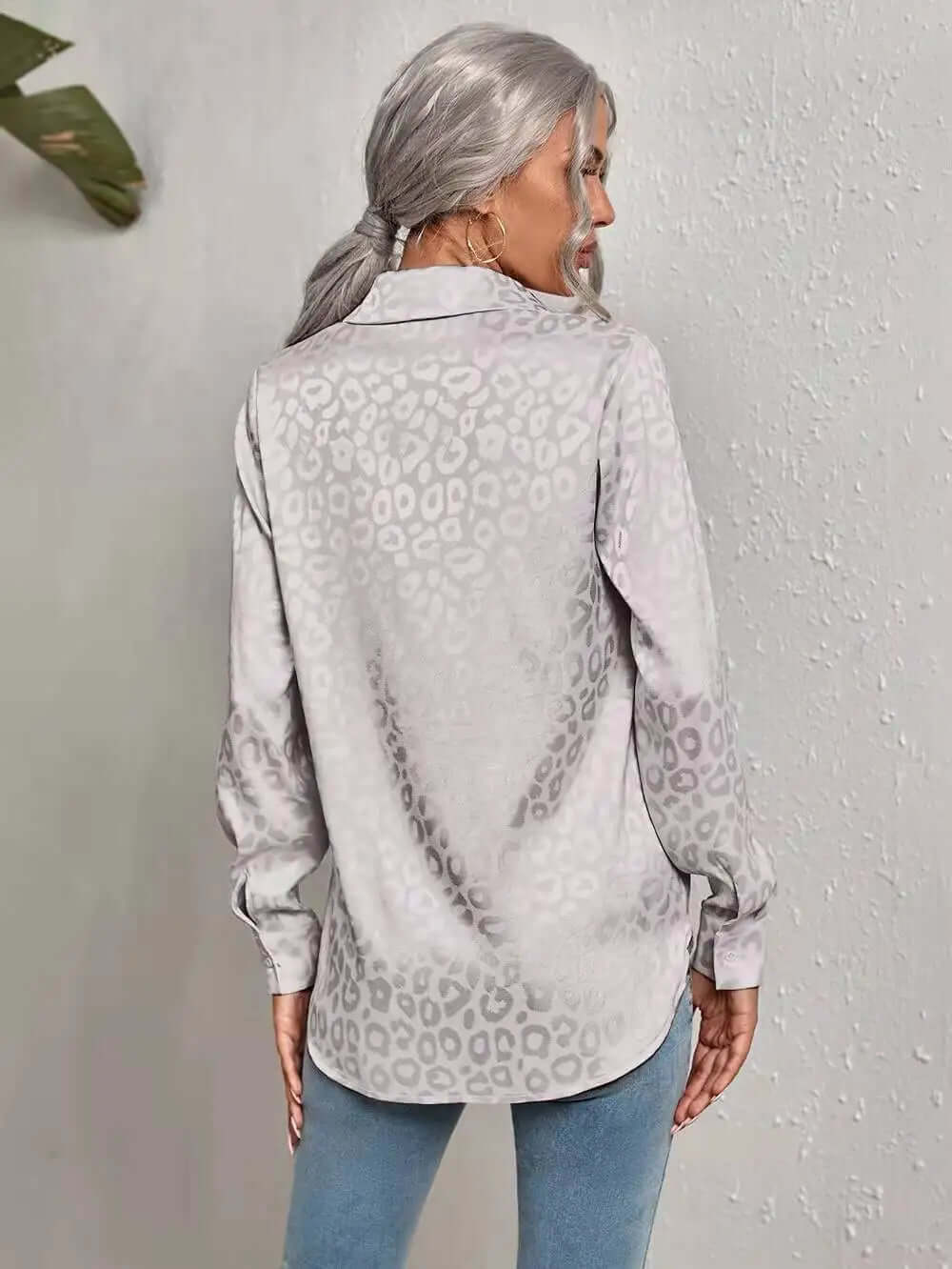 Women's elegant jacquard leopard print blouse, ideal for desk to dinner style.