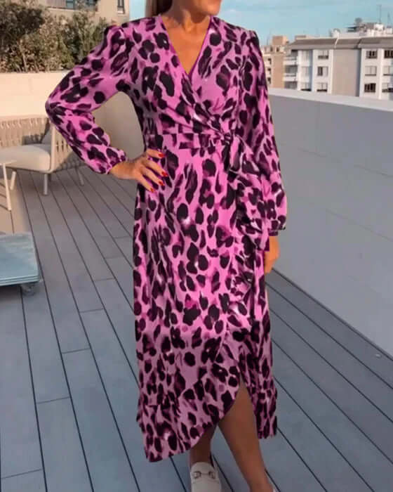 Close-up of a women's leopard print V-neck midi dress fabric, showcasing the trendy animal print pattern.