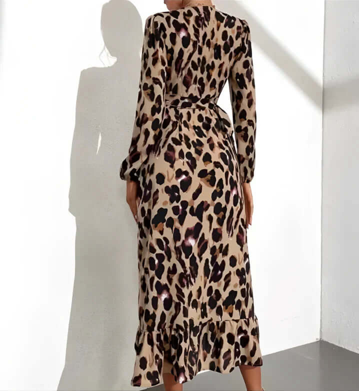 Detail of the flattering V-neckline on a women's elegant leopard print midi dress, a chic fashion piece.