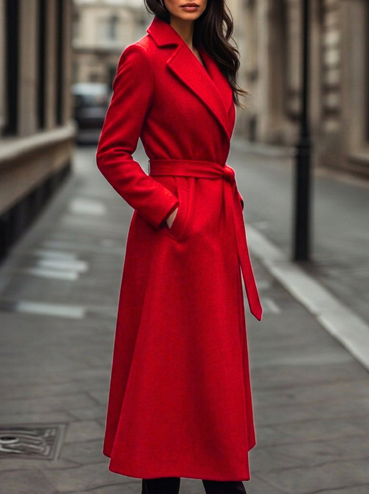 Stylish women's red belted trench coat, a sophisticated long outerwear piece for fall and winter style.