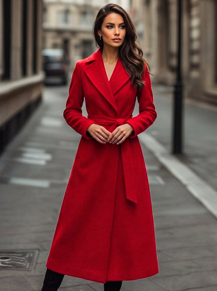 Classic red long trench coat for women, featuring a belted waist for elegant fall and winter outerwear.