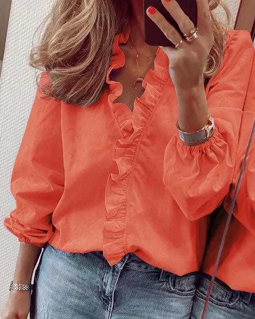 Women's long-sleeve V-neck top with elegant ruffles, a must-have for spring casual style.