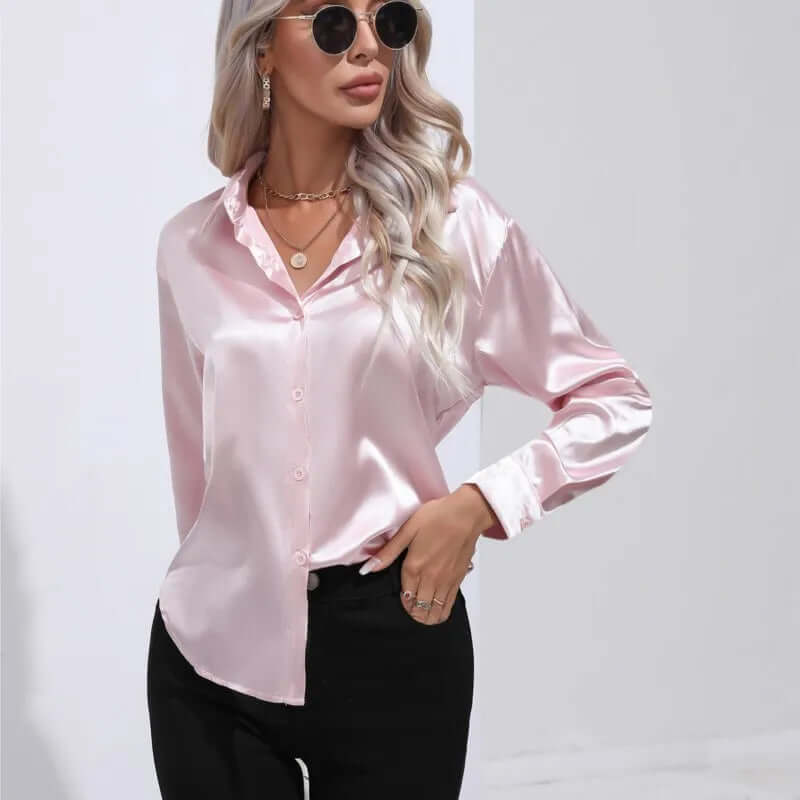 Fashion-forward women's long sleeve satin blouse. Elegant loose fit for a chic and versatile look.