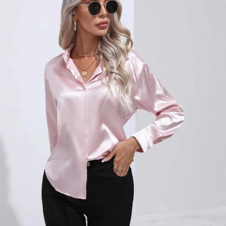 Fashion-forward women's long sleeve satin blouse. Elegant loose fit for a chic and versatile look.