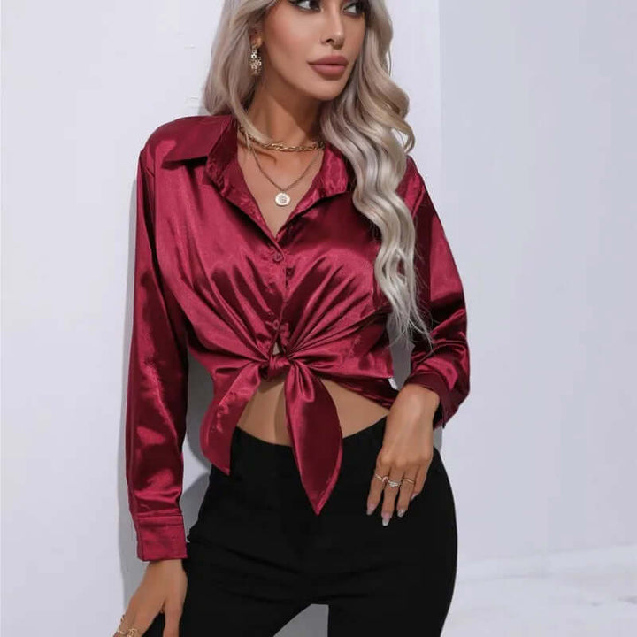 Smooth women's satin blouse, featuring elegant long sleeves and a relaxed loose fit, versatile.