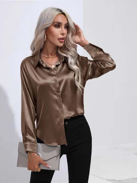 Fashionable women's satin top with elegant long sleeves and a relaxed loose fit design.