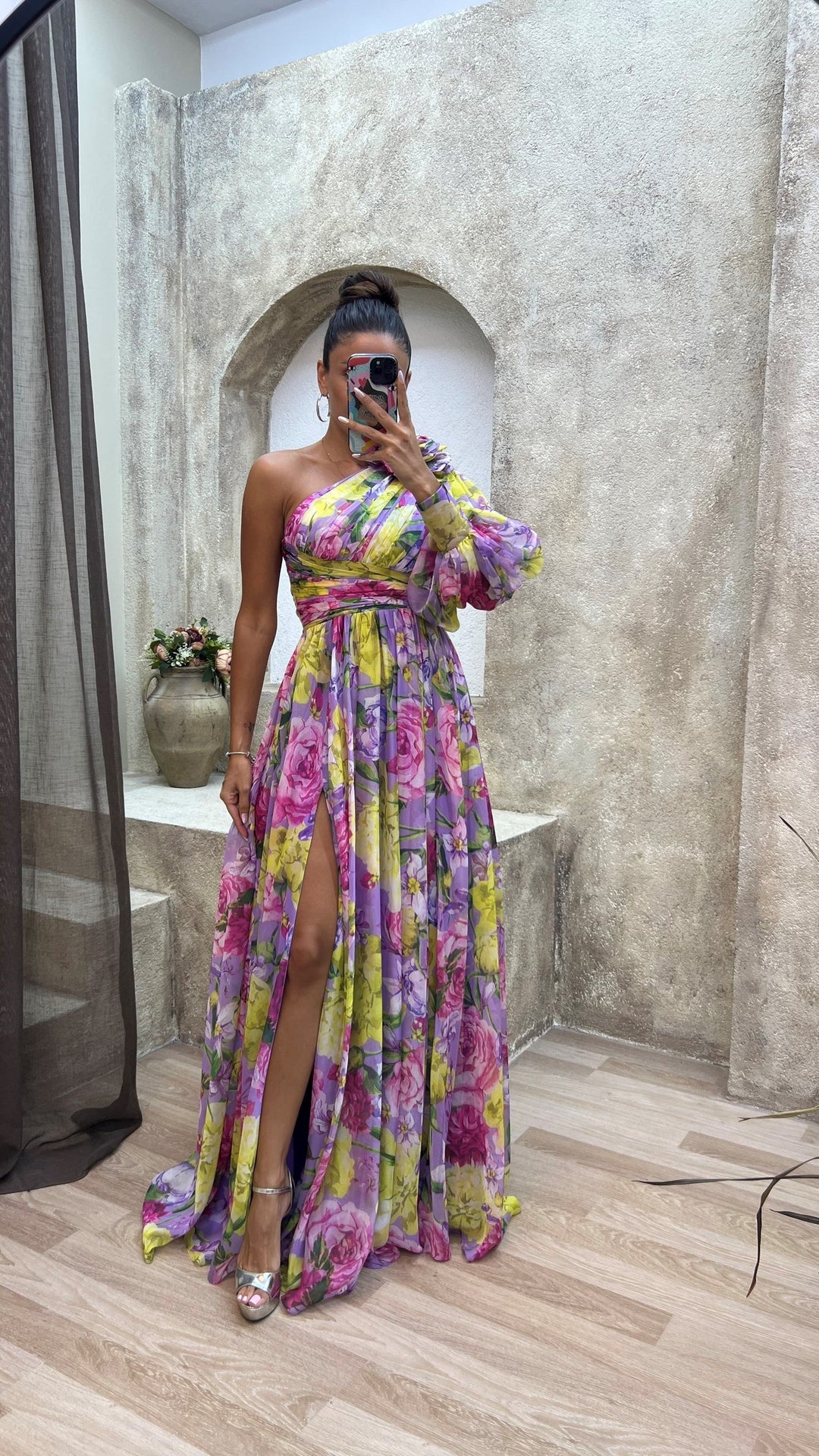 Flowy elegant women's one-shoulder maxi dress, essential for a stylish look at any summer party.
