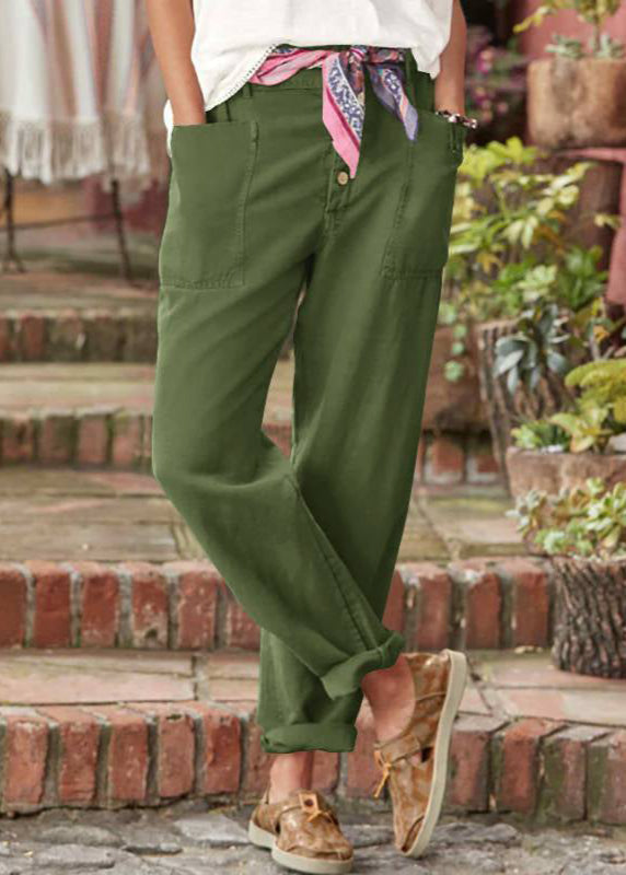 Close-up of the elegant fabric and pleats of these women's wide-leg relaxed trousers, showcasing quality.