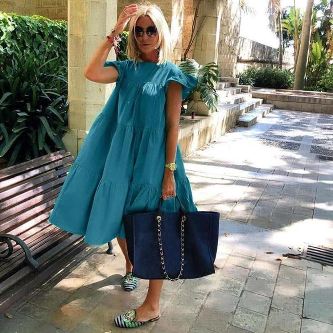 Sleeveless ruffled midi dress for women, ideal for summer vacation wear or elegant party occasions. Flattering fit.
