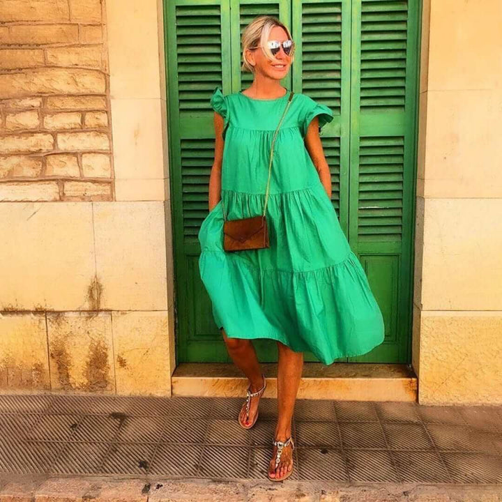 Breathable women's midi dress with elegant ruffles, a versatile sleeveless design for summer fashion & comfort.
