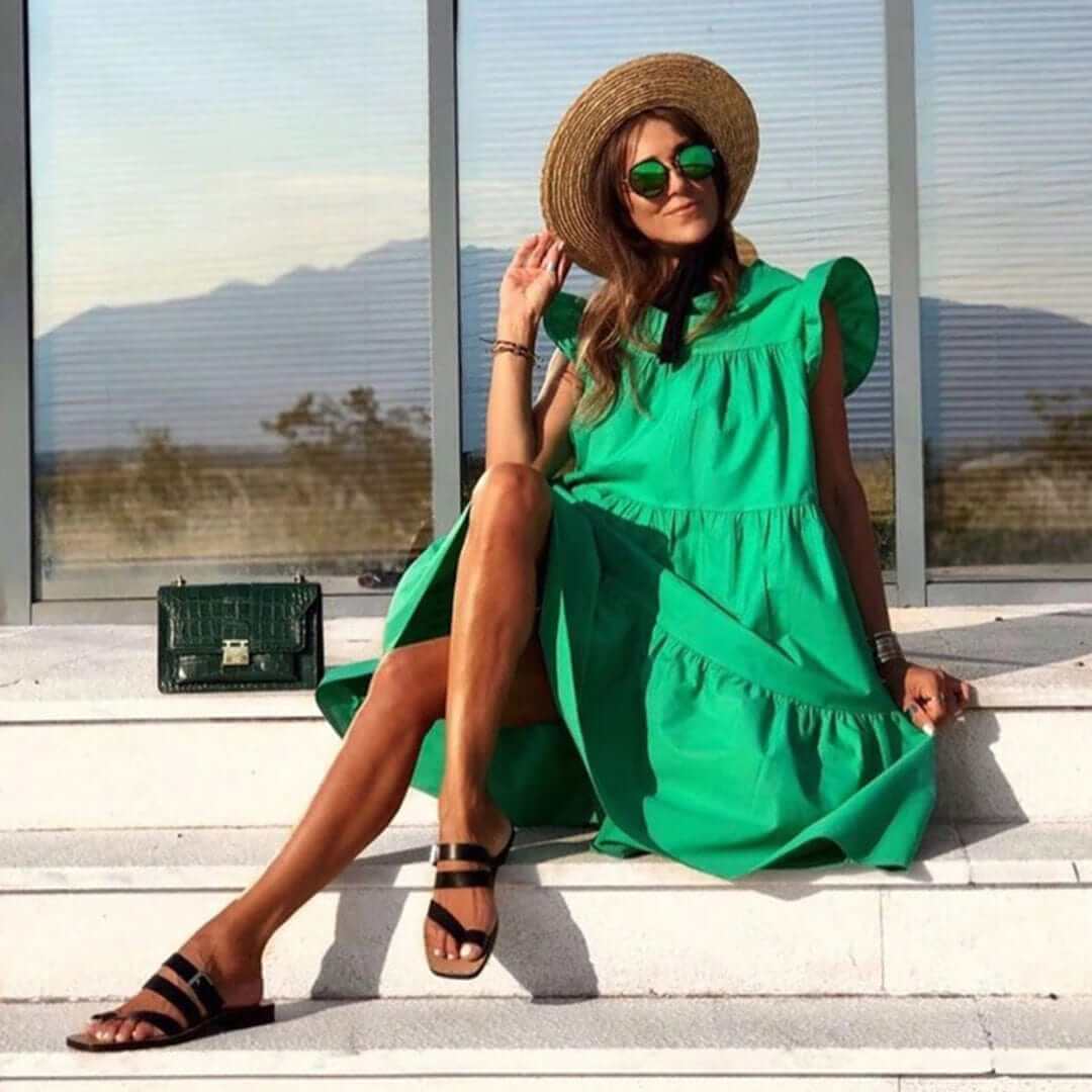 Flattering women's elegant ruffle midi dress, a stylish sleeveless option for summer, casual or party wear.
