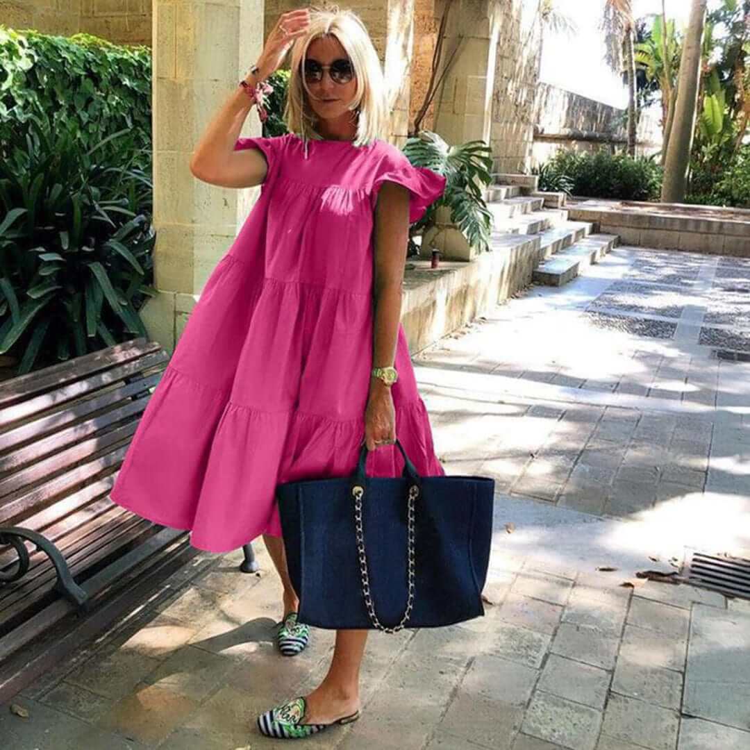 Elegant women's sleeveless midi dress with delicate ruffles, a breathable and flattering choice for summer fashion.