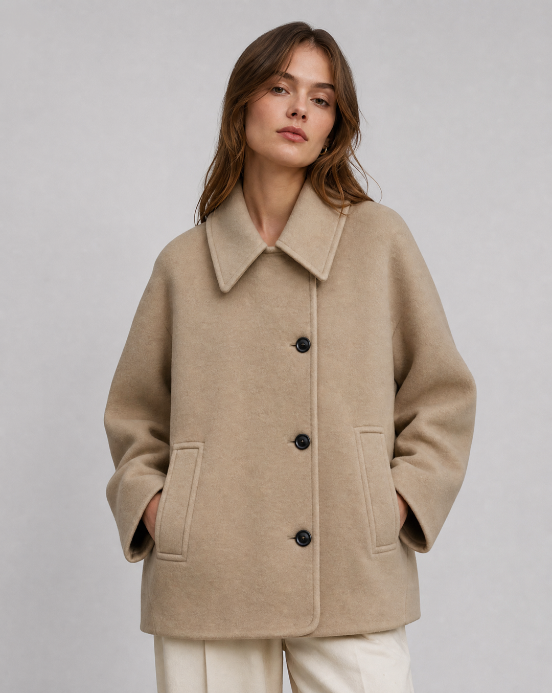 Stylish women's black short coat, an elegant outerwear jacket for everyday casual chic.