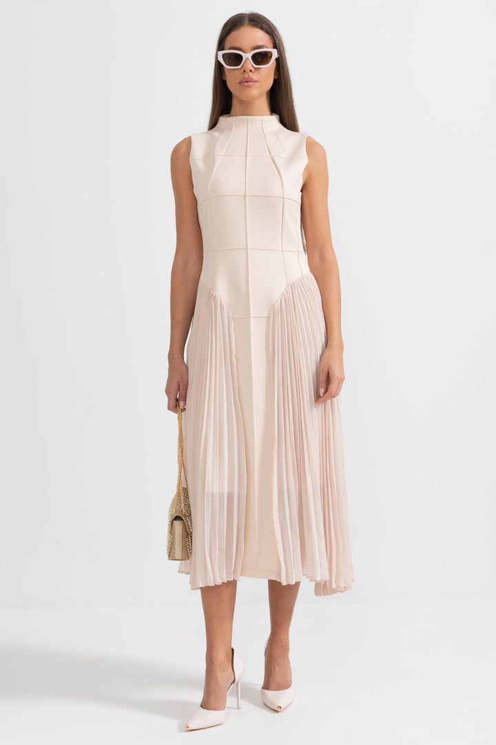 Women's elegant sleeveless pleated midi cocktail dress for special occasions.