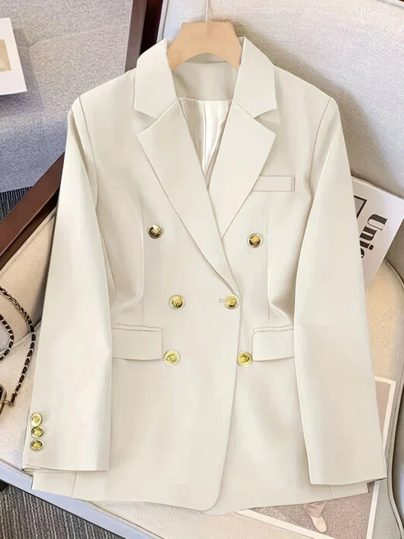 Professional women's blazer, slim silhouette, adorned with golden buttons. Ideal for sophisticated business attire.