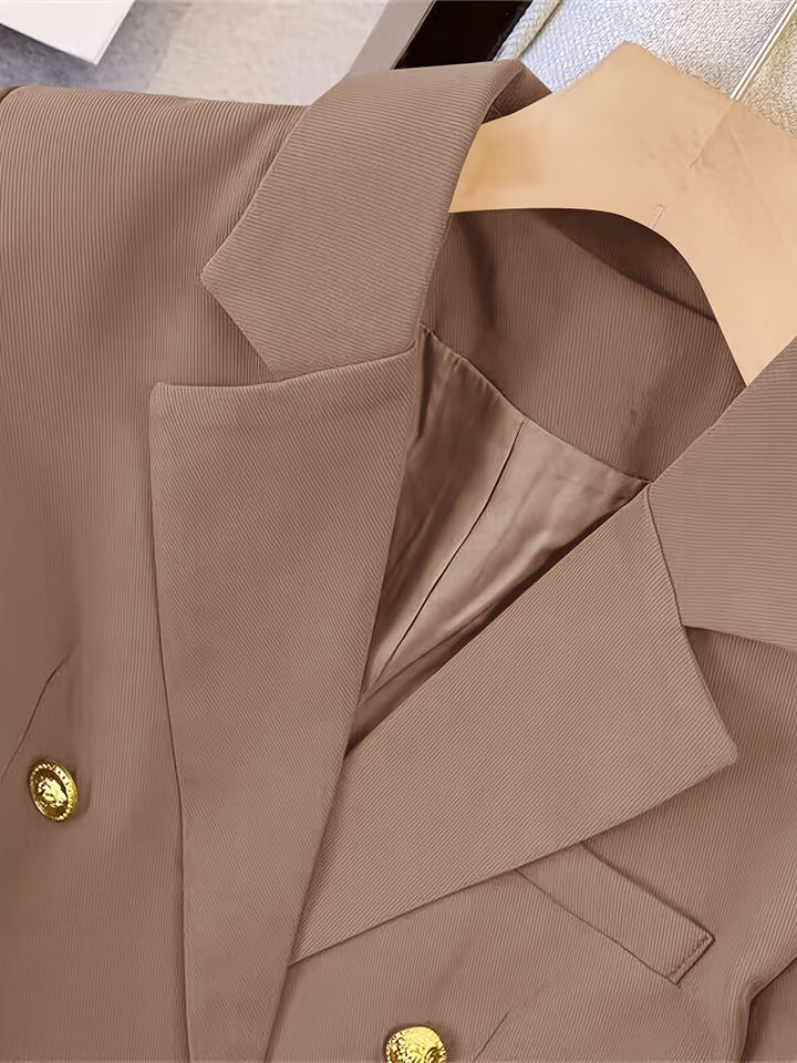 Elegant women's slim-fit blazer, detailed with golden buttons, offering a sleek and refined profile for any event.
