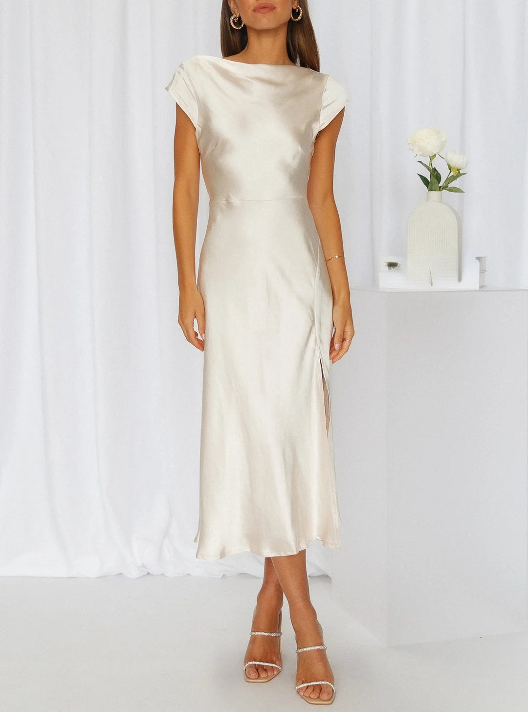 Chic women's sleeveless midi slip dress. Luxurious fabric, perfect for formal parties, evening events, and special occasions.