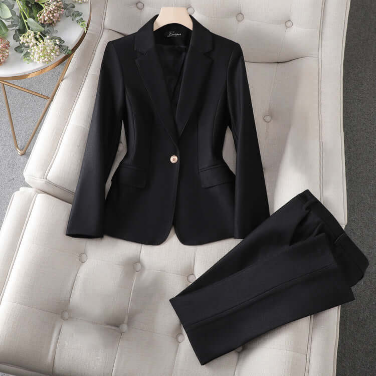 Professional women's tailored pantsuit, ideal for business casual or formal office attire. Elegant & chic.