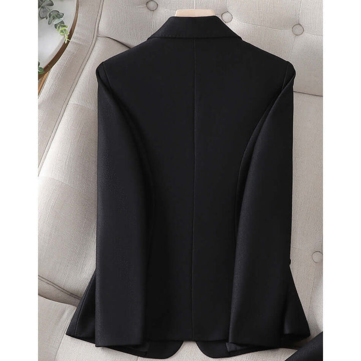 Modern women's tailored pantsuit, an elegant two-piece set for professional business and office style.
