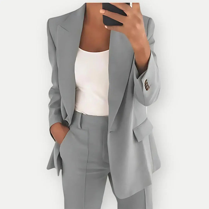 Women's elegant polyester tailored blazer & trousers set. A stylish professional business suit.