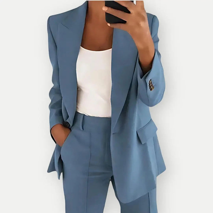 Women's formal tailored blazer & trousers set. Elegant two-piece suit for professional business wear.