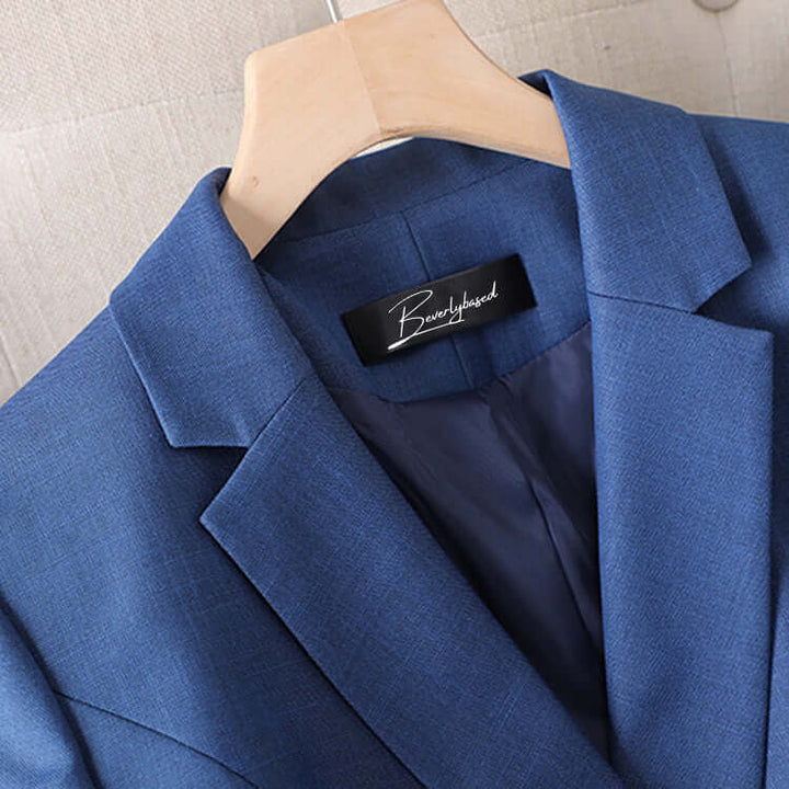 Modern women's business suit set; a professional blazer and tailored pants, essential for sophisticated workwear.