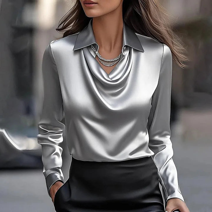 Stylish women's shimmering V-neck blouse, versatile for evening wear, office fashion, or casual style.