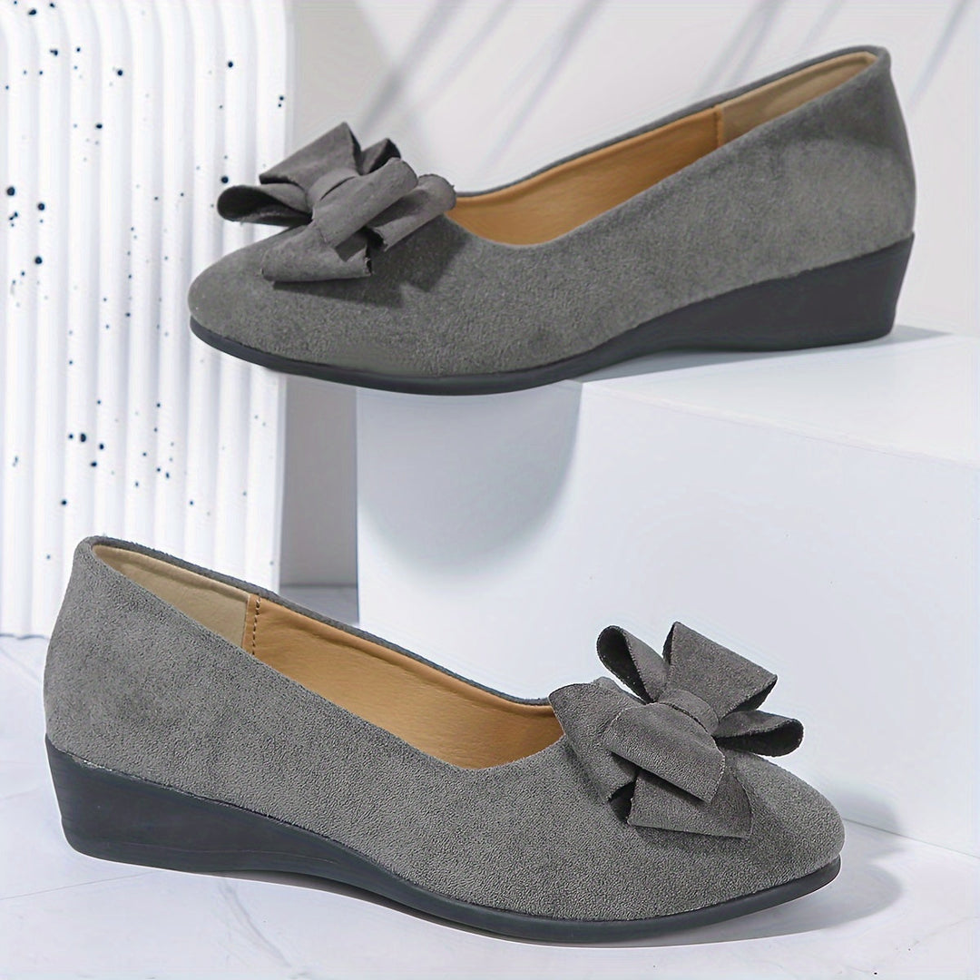 Women's elegant slip-on wedge shoes, versatile for daily wear.