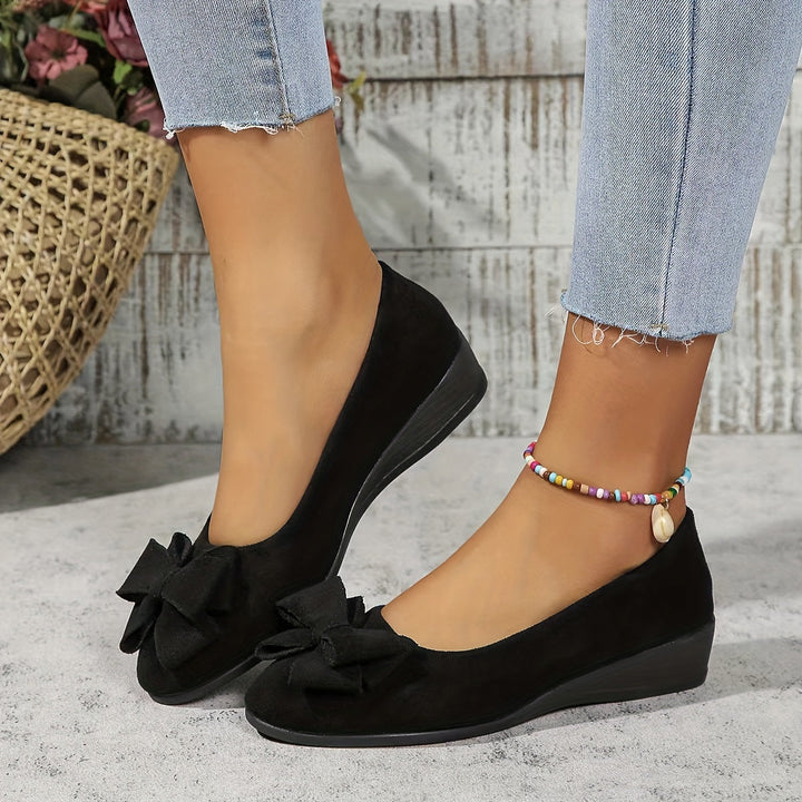 Comfortable women's slip-on wedge shoes, perfect for everyday wear.