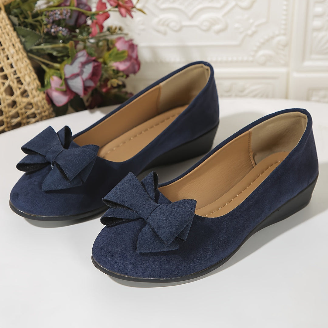 Comfortable women's flats, wedge heel, ballet style, and bow accent.