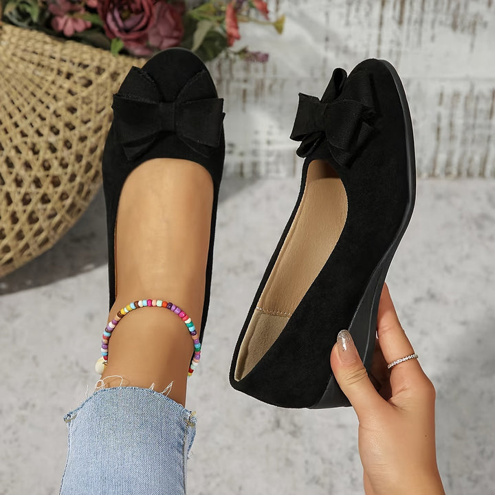 Stylish women's ballet flats, comfortable wedge, and charming bow detail.